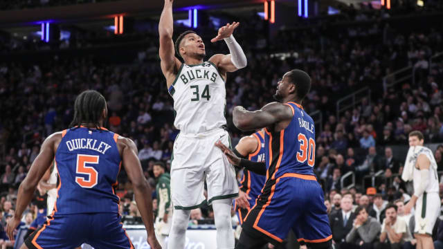 Milwaukee Bucks forward Giannis Antetokounmpo (34) shoots over New York Knicks forward Julius Randle (30) 